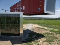 a container hanging upside down outside of the house in its enclosure, for protection of mosquito