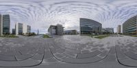 circular mirrors reflect the scenery of office buildings and sidewalking in the foreground, with clouds in the sky and sun shining in the distance