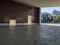 a building with some brown bricks and a door in the middle of the ground there is no floor space for any building