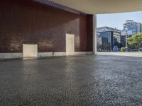 a building with some brown bricks and a door in the middle of the ground there is no floor space for any building