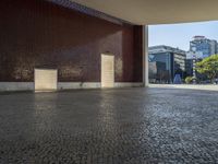 a building with some brown bricks and a door in the middle of the ground there is no floor space for any building