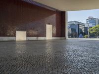 a building with some brown bricks and a door in the middle of the ground there is no floor space for any building