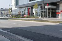 a city street is empty and has buildings lining the street next to it for pedestrians to use