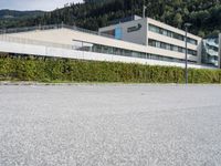 a parking space sits next to a building in the mountainside area of a hotel