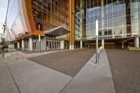 an entrance way that shows the entrance of the building with no doors, and the sidewalk is empty