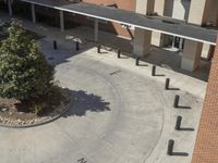 this school has two parking spaces, two stairs and an entrance that leads to the second floor