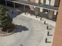 this school has two parking spaces, two stairs and an entrance that leads to the second floor