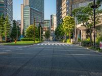 an empty road with a street sign at the curb in front of an office building