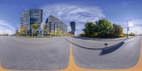 the street is empty in this three - dimensional image and the sky is blue, with a few buildings behind it