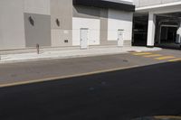 an empty parking garage and parking meter on the sidewalk in the city of los angeles