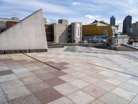 the paved plaza area has an unusual shape and is very clean with no one around