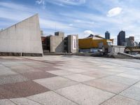 the paved plaza area has an unusual shape and is very clean with no one around