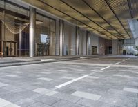 empty building with floor and columns and an open entrance way in front of the building