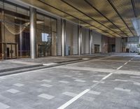 empty building with floor and columns and an open entrance way in front of the building