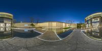 a panorama is seen in this very shiny photo of a large pool in the middle of a building and with columns that form like buildings