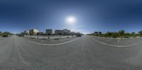 a 360 - angle photograph of a sunny day in front of city streets and a street