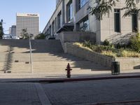 a fire hydrant is next to a red line on some steps near a building