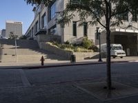 a fire hydrant is next to a red line on some steps near a building