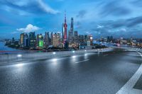 a highway with a city view in the distance on a cloudy day in shanghai, china