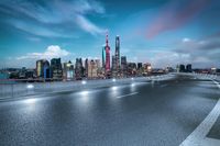 a highway with a city view in the distance on a cloudy day in shanghai, china