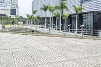 a paved road leading to modern architecture in the city center of singapore, asia and southeast asia