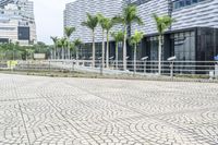 a paved road leading to modern architecture in the city center of singapore, asia and southeast asia