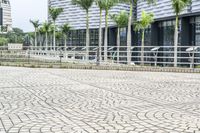 a paved road leading to modern architecture in the city center of singapore, asia and southeast asia