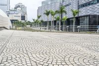 a paved road leading to modern architecture in the city center of singapore, asia and southeast asia