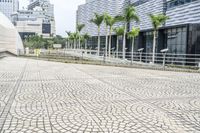 a paved road leading to modern architecture in the city center of singapore, asia and southeast asia