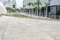 a paved road leading to modern architecture in the city center of singapore, asia and southeast asia