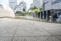 a paved road leading to modern architecture in the city center of singapore, asia and southeast asia