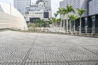 a paved road leading to modern architecture in the city center of singapore, asia and southeast asia