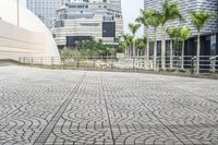 a paved road leading to modern architecture in the city center of singapore, asia and southeast asia