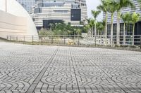 a paved road leading to modern architecture in the city center of singapore, asia and southeast asia