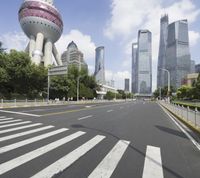 there is a picture of the city in china looking down an empty street with white lines