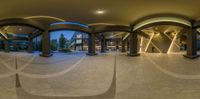 a wide angle image of the entrance to the building from outside looking down on it