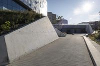 a view of an outside area of an office building with large windows and a circular driveway