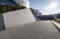 a view of an outside area of an office building with large windows and a circular driveway