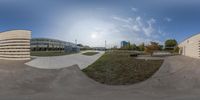 two circular photos showing buildings, an outside area and walkways and a building with parking meters across the way