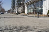 a building with glass on the sides is shown in this picture a bike is parked on the sidewalk