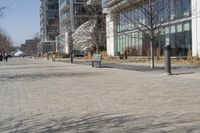 a building with glass on the sides is shown in this picture a bike is parked on the sidewalk