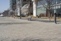 a building with glass on the sides is shown in this picture a bike is parked on the sidewalk