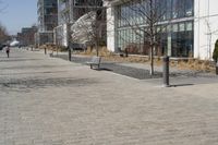 a building with glass on the sides is shown in this picture a bike is parked on the sidewalk