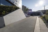 a view of an outside area of an office building with large windows and a circular driveway