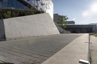 a view of an outside area of an office building with large windows and a circular driveway