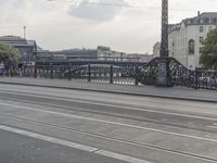 a large bridge with cars crossing it across the road from another bridge to the city