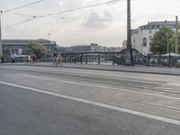 a large bridge with cars crossing it across the road from another bridge to the city