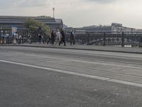 a large bridge with cars crossing it across the road from another bridge to the city