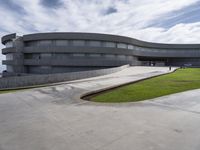 the building is large in size and made out of concrete and has two levels for ramps on both sides