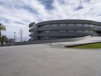 the building is large in size and made out of concrete and has two levels for ramps on both sides